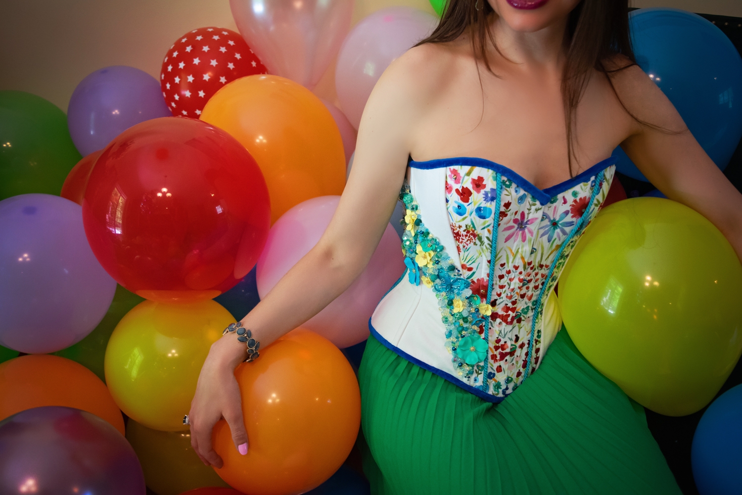 Stella celebrating her birthday surrounded by balloons.