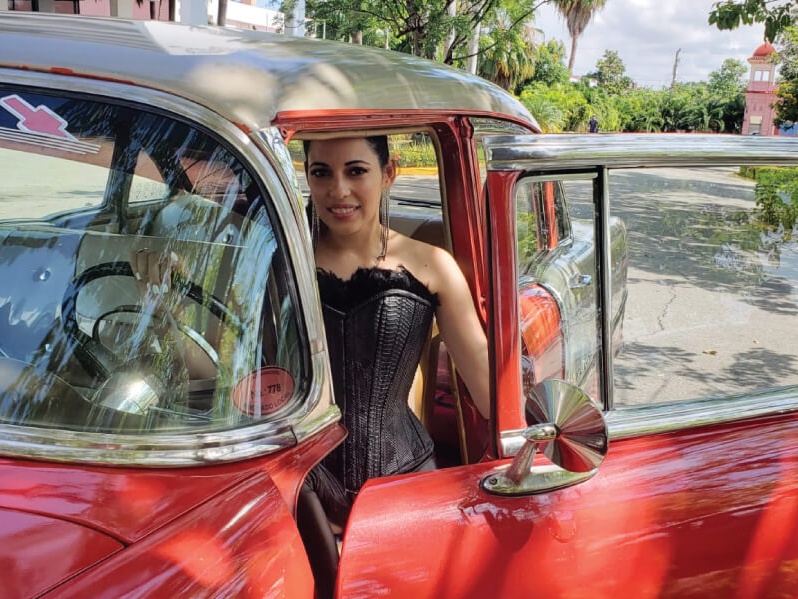 Bring-Champaagne-Corsets-Wherever-You-Go-Beautiful-Woman-In-Black-Snakeskin-Corset-With-Cuban-Car